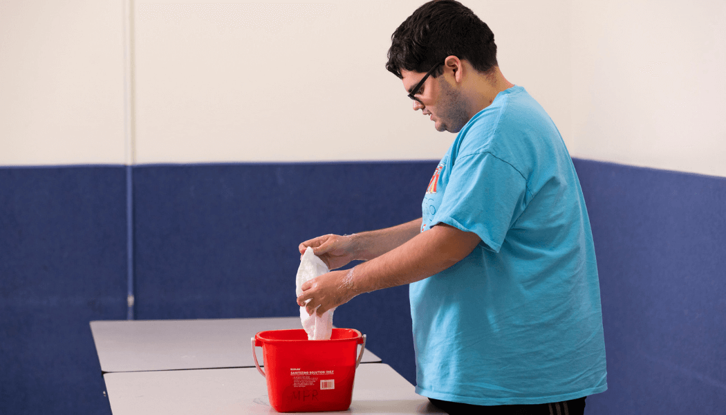 JobSpan - Andrew Cleaning  Cafeteria Tables with Red Bucket