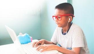Photo of a student on a laptop. Image by schantalao on Freepik